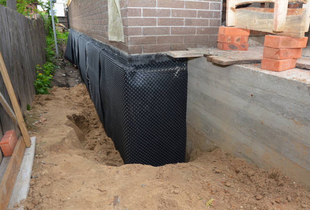 Happy homeowners after waterproofing job in Big Rock